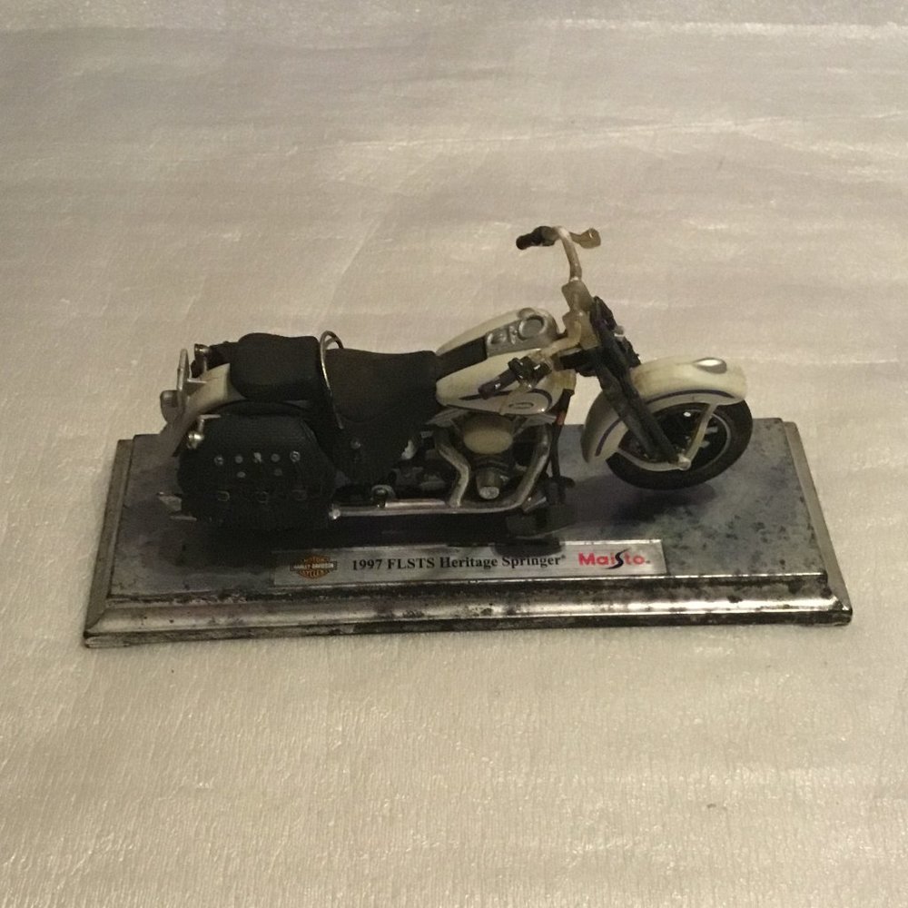 1997 Harley-Davidson FLSTS heritage Springer motorcycle on base by Maisto